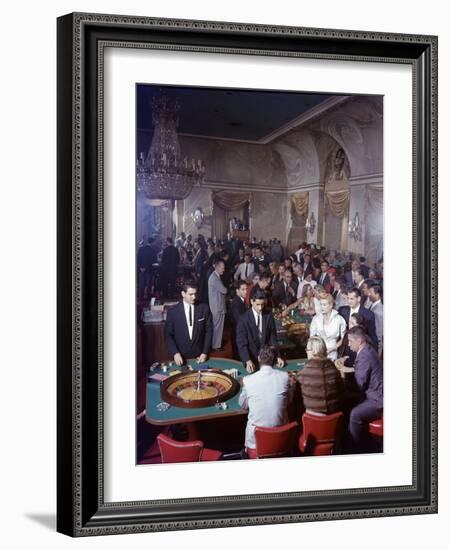 February 11, 1957: Tourists Gambling at the Nacional Hotel in Havana, Cuba-Ralph Morse-Framed Photographic Print