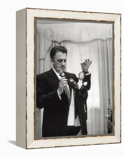 Federico Fellini and the Marionette, Rome 1960-Angelo Cozzi-Framed Premier Image Canvas