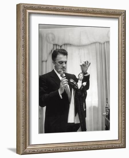 Federico Fellini and the Marionette, Rome 1960-Angelo Cozzi-Framed Photographic Print