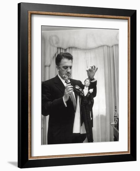 Federico Fellini and the Marionette, Rome 1960-Angelo Cozzi-Framed Photographic Print