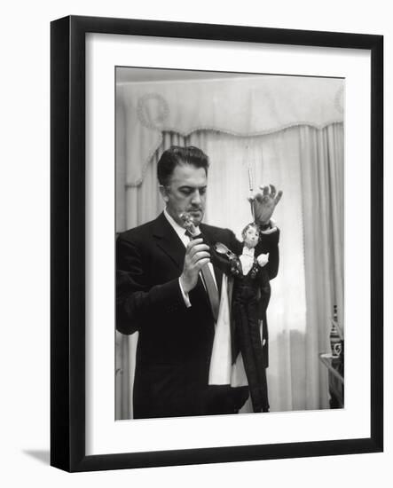 Federico Fellini and the Marionette, Rome 1960-Angelo Cozzi-Framed Photographic Print