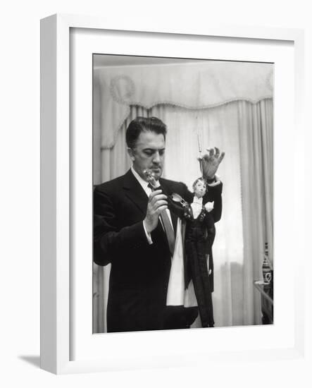 Federico Fellini and the Marionette, Rome 1960-Angelo Cozzi-Framed Photographic Print