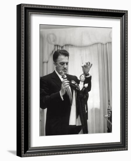 Federico Fellini and the Marionette, Rome 1960-Angelo Cozzi-Framed Photographic Print