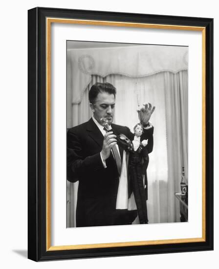 Federico Fellini and the Marionette, Rome 1960-Angelo Cozzi-Framed Photographic Print