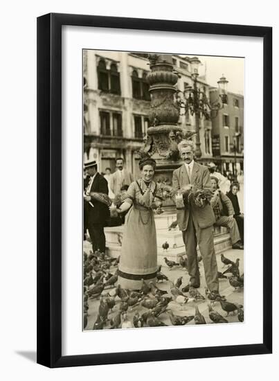 Feeding the Pigeons in the City Square-null-Framed Art Print