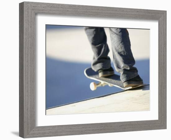 Feet on a Skateboard at the Edge of a Ramp-null-Framed Photographic Print