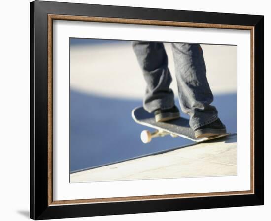 Feet on a Skateboard at the Edge of a Ramp-null-Framed Photographic Print