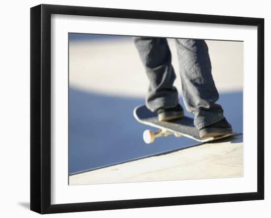 Feet on a Skateboard at the Edge of a Ramp-null-Framed Photographic Print