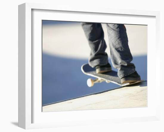 Feet on a Skateboard at the Edge of a Ramp-null-Framed Photographic Print