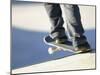 Feet on a Skateboard at the Edge of a Ramp-null-Mounted Photographic Print