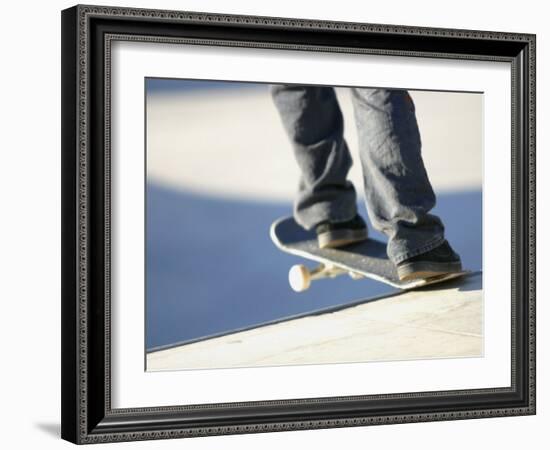 Feet on a Skateboard at the Edge of a Ramp-null-Framed Photographic Print