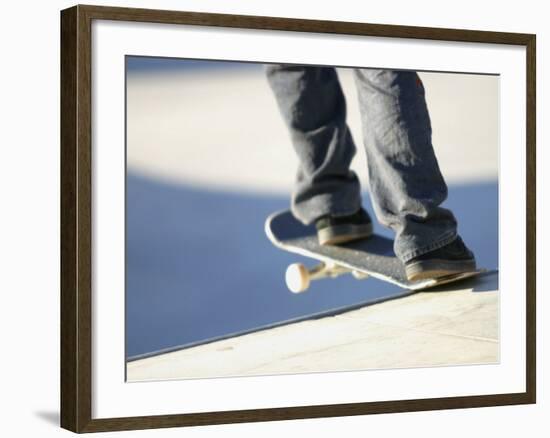 Feet on a Skateboard at the Edge of a Ramp-null-Framed Photographic Print