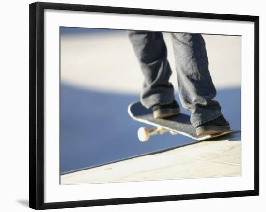 Feet on a Skateboard at the Edge of a Ramp-null-Framed Photographic Print