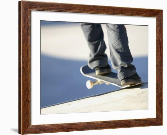 Feet on a Skateboard at the Edge of a Ramp-null-Framed Photographic Print