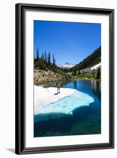 Female Backpacker Stands On A Floating Shelf Of Snow Melt On Small Lake Along E Lostine River Trail-Ben Herndon-Framed Photographic Print