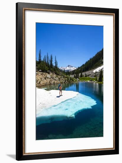 Female Backpacker Stands On A Floating Shelf Of Snow Melt On Small Lake Along E Lostine River Trail-Ben Herndon-Framed Photographic Print