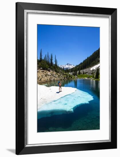 Female Backpacker Stands On A Floating Shelf Of Snow Melt On Small Lake Along E Lostine River Trail-Ben Herndon-Framed Photographic Print