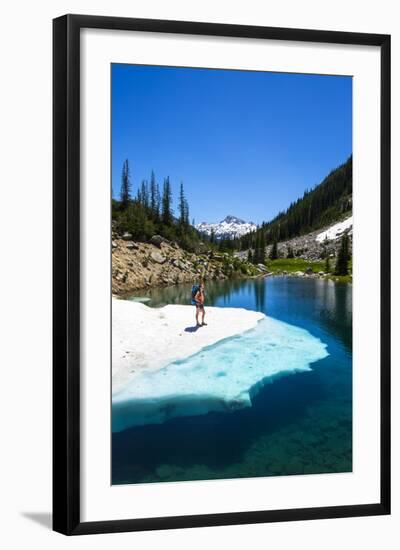 Female Backpacker Stands On A Floating Shelf Of Snow Melt On Small Lake Along E Lostine River Trail-Ben Herndon-Framed Photographic Print