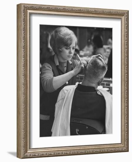 Female Barber Cutting a Customer's Hair in a Barber Shop-Ralph Crane-Framed Photographic Print