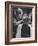 Female Barber Cutting a Customer's Hair in a Barber Shop-Ralph Crane-Framed Photographic Print