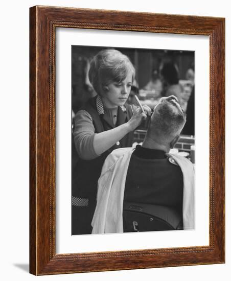 Female Barber Cutting a Customer's Hair in a Barber Shop-Ralph Crane-Framed Photographic Print