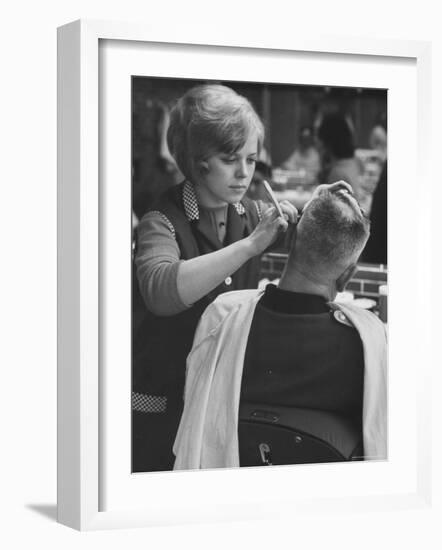 Female Barber Cutting a Customer's Hair in a Barber Shop-Ralph Crane-Framed Photographic Print