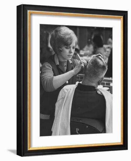 Female Barber Cutting a Customer's Hair in a Barber Shop-Ralph Crane-Framed Photographic Print