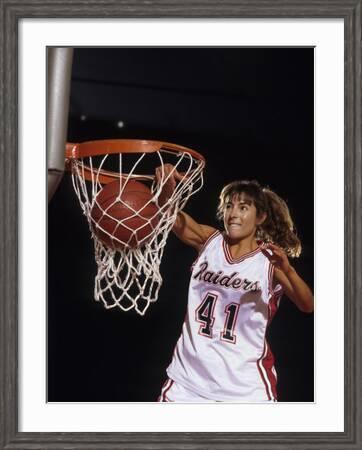 female basketball player dunking
