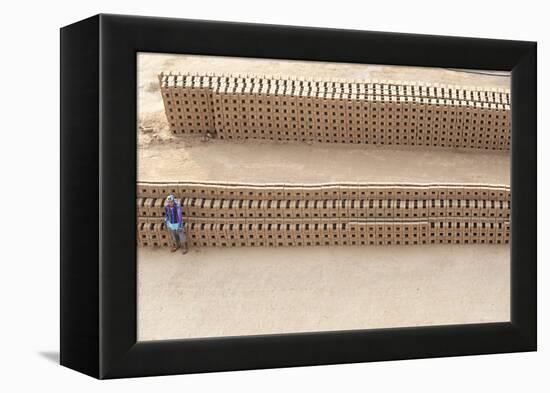 Female Brick Worker Standing Beside Hand Made Bricks Stacked to Dry before Baking, Rajasthan, India-Annie Owen-Framed Premier Image Canvas