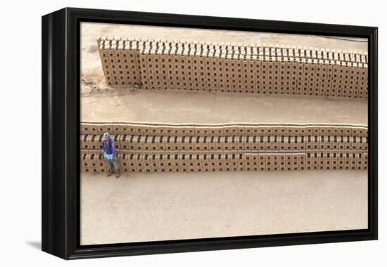 Female Brick Worker Standing Beside Hand Made Bricks Stacked to Dry before Baking, Rajasthan, India-Annie Owen-Framed Premier Image Canvas