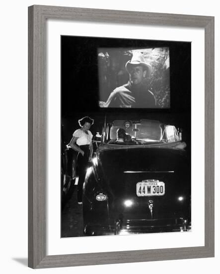 Female Car-Hop Taking Order from Couple in Convertible Car During Movie at Rancho Drive in Theater-Allan Grant-Framed Photographic Print