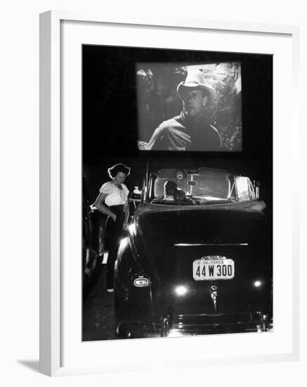 Female Car-Hop Taking Order from Couple in Convertible Car During Movie at Rancho Drive in Theater-Allan Grant-Framed Photographic Print