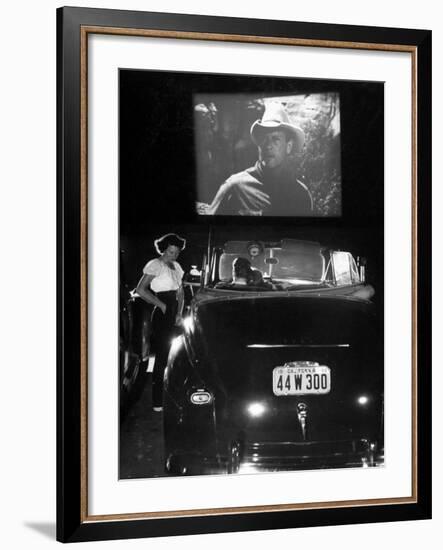 Female Car-Hop Taking Order from Couple in Convertible Car During Movie at Rancho Drive in Theater-Allan Grant-Framed Photographic Print