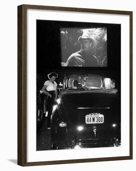 Female Car-Hop Taking Order from Couple in Convertible Car During Movie at Rancho Drive in Theater-Allan Grant-Framed Photographic Print