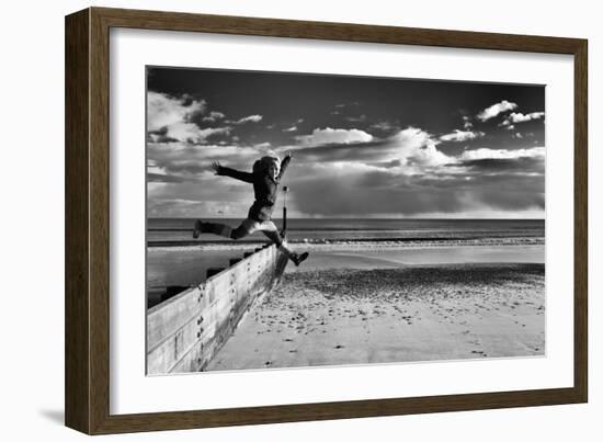 Female Figure Jumping on a Beach-Rory Garforth-Framed Photographic Print