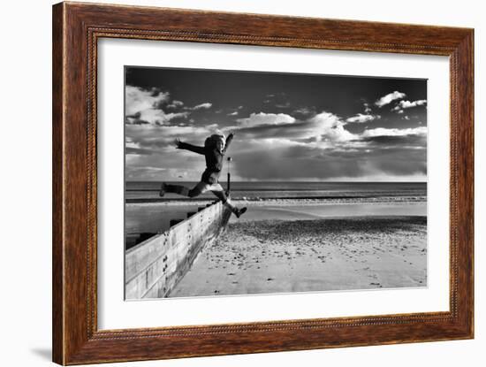 Female Figure Jumping on a Beach-Rory Garforth-Framed Photographic Print