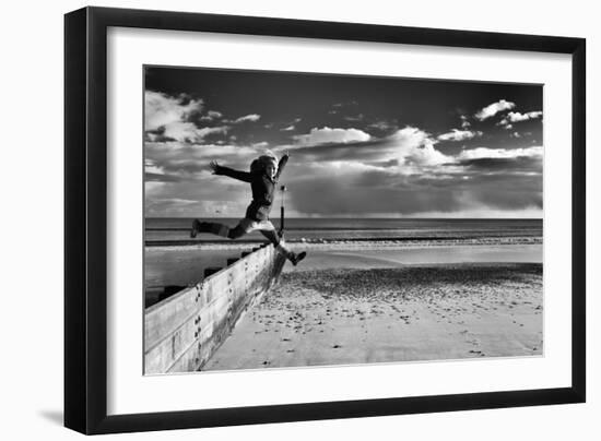 Female Figure Jumping on a Beach-Rory Garforth-Framed Photographic Print