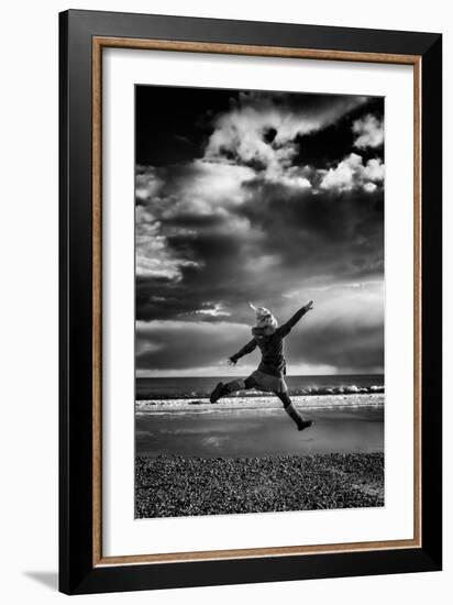 Female Figure Jumping on a Beach-Rory Garforth-Framed Photographic Print