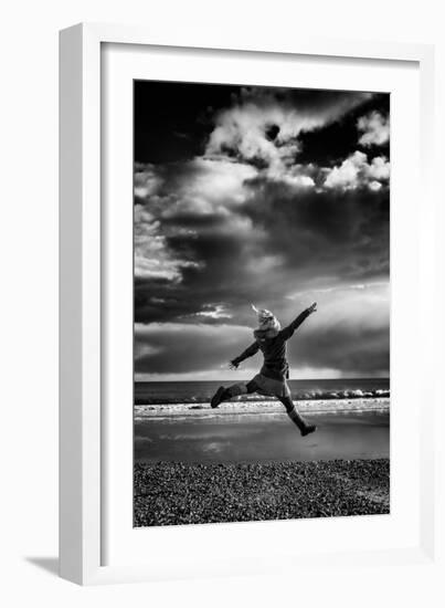 Female Figure Jumping on a Beach-Rory Garforth-Framed Photographic Print