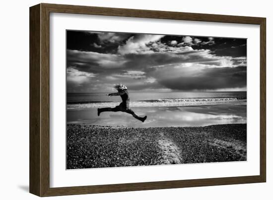 Female Figure Jumping on a Beach-Rory Garforth-Framed Photographic Print