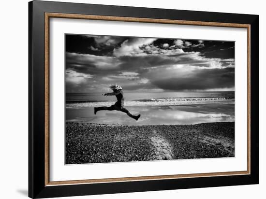 Female Figure Jumping on a Beach-Rory Garforth-Framed Photographic Print