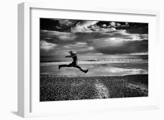 Female Figure Jumping on a Beach-Rory Garforth-Framed Photographic Print