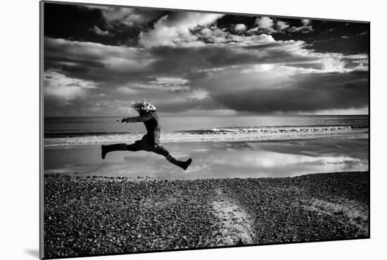 Female Figure Jumping on a Beach-Rory Garforth-Mounted Photographic Print