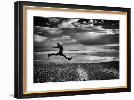 Female Figure Jumping on a Beach-Rory Garforth-Framed Photographic Print