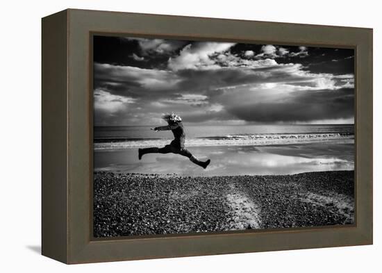 Female Figure Jumping on a Beach-Rory Garforth-Framed Premier Image Canvas