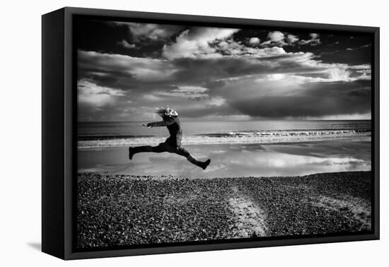 Female Figure Jumping on a Beach-Rory Garforth-Framed Premier Image Canvas