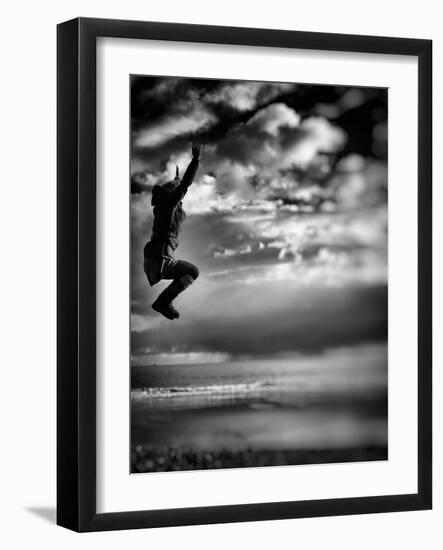 Female Figure Jumping on a Beach-Rory Garforth-Framed Photographic Print