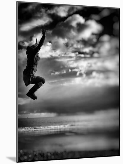 Female Figure Jumping on a Beach-Rory Garforth-Mounted Photographic Print