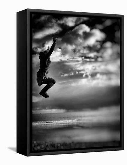 Female Figure Jumping on a Beach-Rory Garforth-Framed Premier Image Canvas