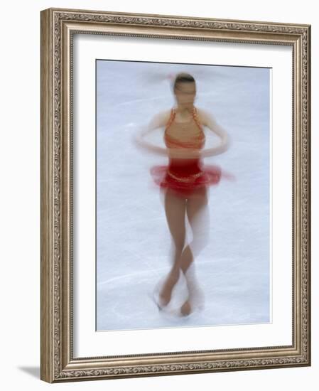 Female Figure Skater Preforming a Spin-null-Framed Photographic Print